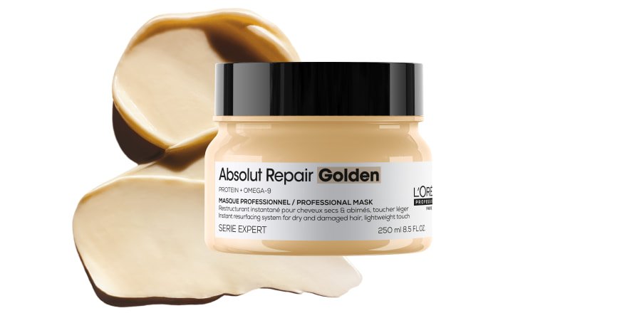 Imagen del producto: mascarilla capilar L’Oréal Professionnel Absolut Repair sobre un fondo texturizado, que resalta su textura rica y untuosa para cabello dañado.